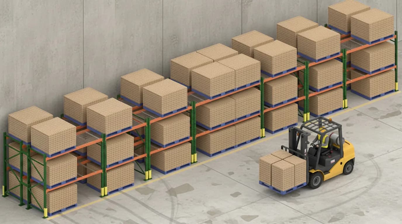 Selective pallet racking organized against a warehouse wall.